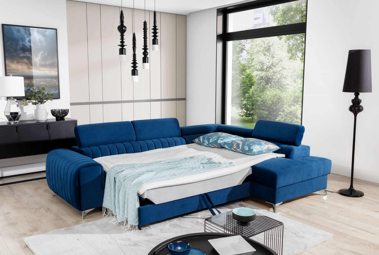 Wunderschöne Wohnlandschaft Laurence mit wunderschönem L-förmigem Sofa in blauer Farbe mit Bettfunktion